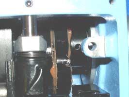 Turn upper shaft and insert positioning pin into the hole of cam through the positioning hole on machine