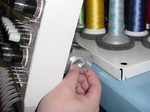 4. Turn the knob and stop at a needle stop position.