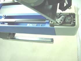 Loosen screw on solenoid base.