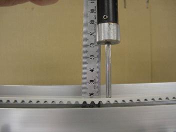 Push belt at center of belt by push gauge with 500gf.
