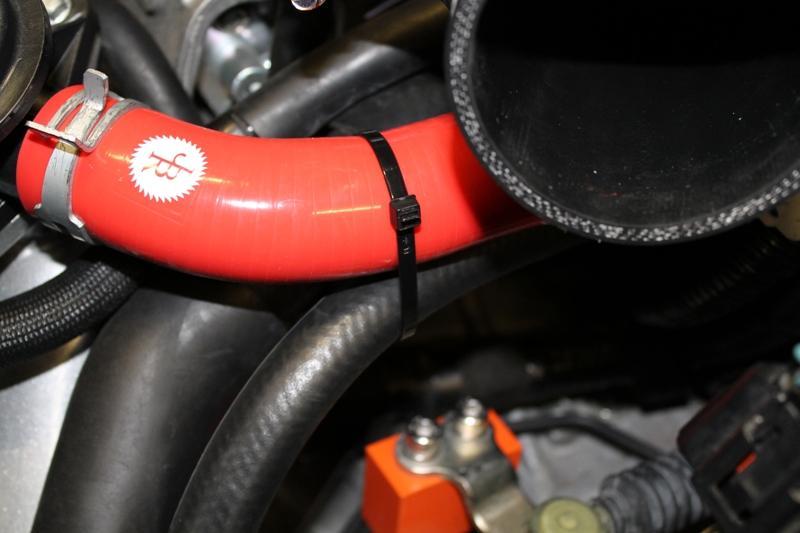 13. Loosely secure the hose from the Cam Cover to the bypass hose and/or the radiator hose so it doesn t interfere with the shifter linkage. 14.