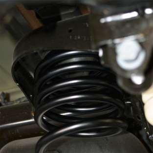 coil compressor can be used to compress the coil to allow fitment. K.