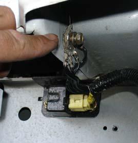 Remove the bracket from the battery tray as shown