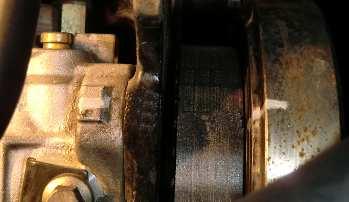 Using the tool specified by VW, loosen the crankshaft retaining bolt.