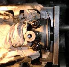 Remove the crankshaft pulley and timing system lower cover.
