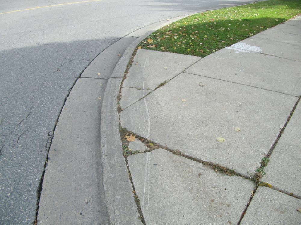 Figure 8: Evidence of scrapes and tire marks on the sidewalk at