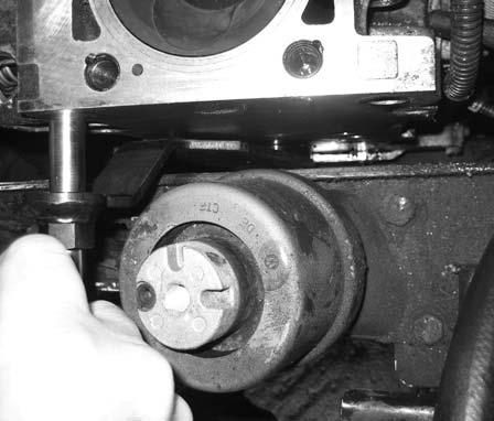 Remove the camshaft drive gear. IMPORTANT: Care must be taken when removing the camshaft drive gear and the compensating link.
