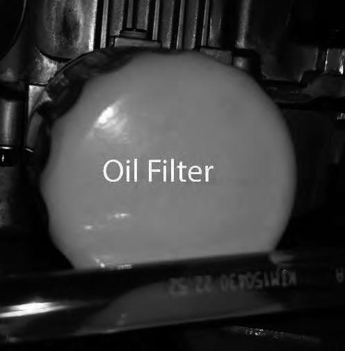 Place new filter in shallow pan with open end up. Fill with new oil until oil reaches the bottom of the threads. Allow two minutes for oil to be absorbed by filter material. 4.