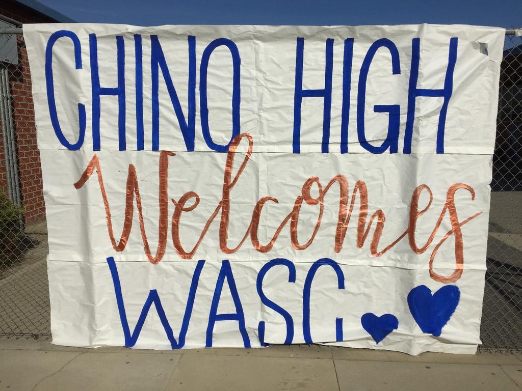 A student-drawn sign welcomes the Western Association