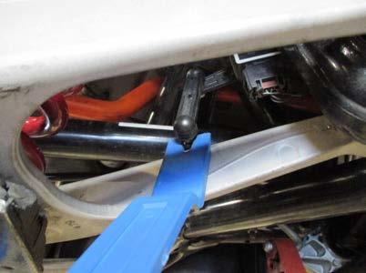 5. Using either a floor jack, or a trans jack, support the lower control arm.