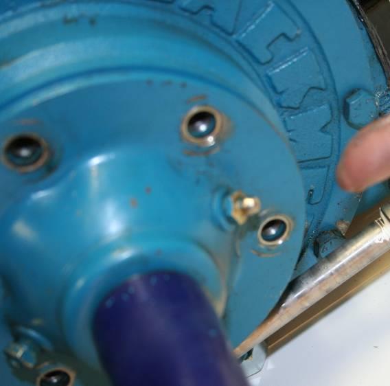 Remove bolts that hold the pump end plate in position and rotate the so that the grease fitting is at the 3