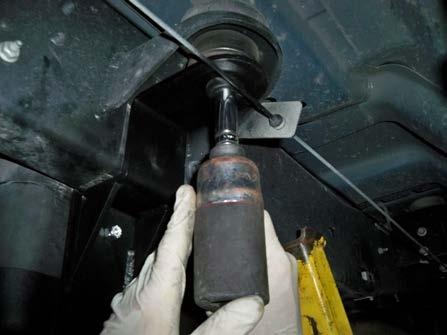 10) Replace cab mount bolt with its existing washers