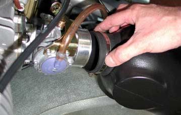 INSTALL THE SPARK PLUG INSTALL THE SPARK PLUG CAP MAKING SURE THAT THE SPRING IN THE