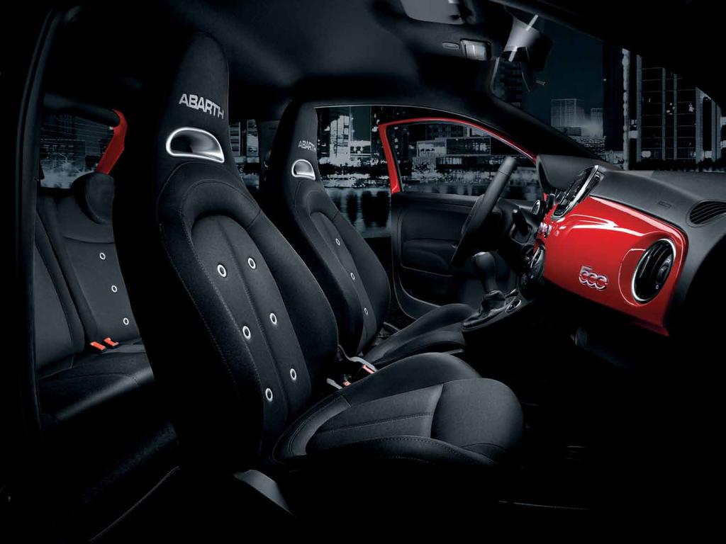 Insert driver to continue. The Abarth 595 interior: new sporty fabric seats and steel pedals.