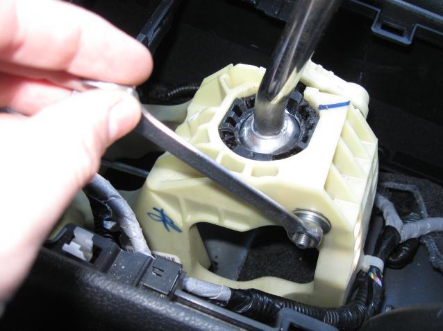 connectors for the heated seats, unplug these wires, also cut the tie-wrap holding the shift