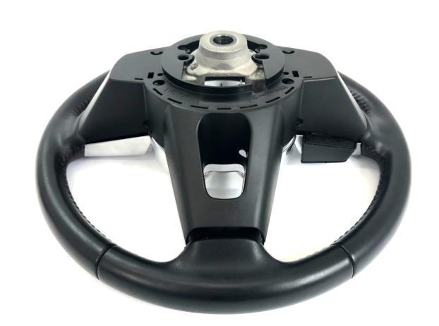 4. OE Components Removal a) Locate the four retention clips on the back of the steering wheel as shown in Figure 4a.