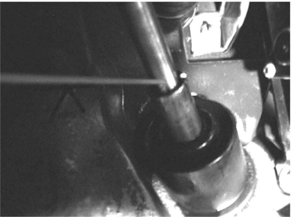 Page 2 of 5 From inside the vehicle, spray GM Superlube, P/N 12346241 (in Canada, use P/N 10953474), into the gap between the inner shaft and outer shaft at the steering shaft for about two to three