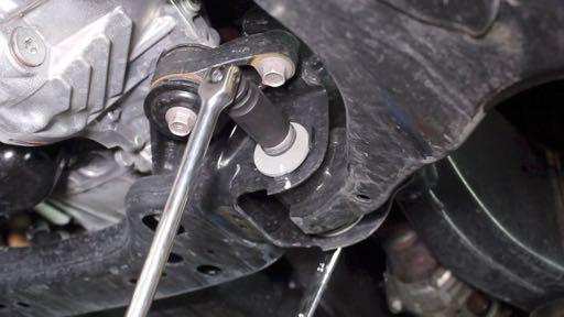 combination wrench, and loosen the bolt using a 22mm socket.