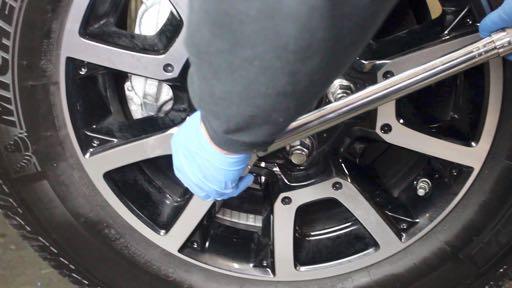 Step 98 Tighten the lug nuts in a progressively