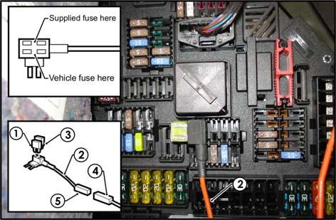 Remove the vehicle 20A Trailer fuse (1) and insert it into the lower slot of the add-a-fuse