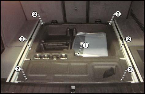 In the luggage compartment, remove the floor carpet