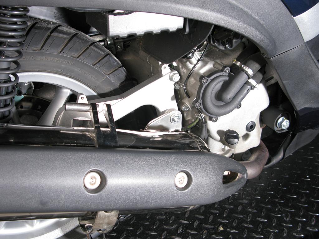 Loosen the muffler s inlet clamp and unscrew the muffler s bracket clamp (Figure 1). Figure 1 3.