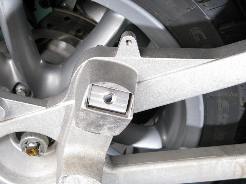 correctly into the swing arm, as shown