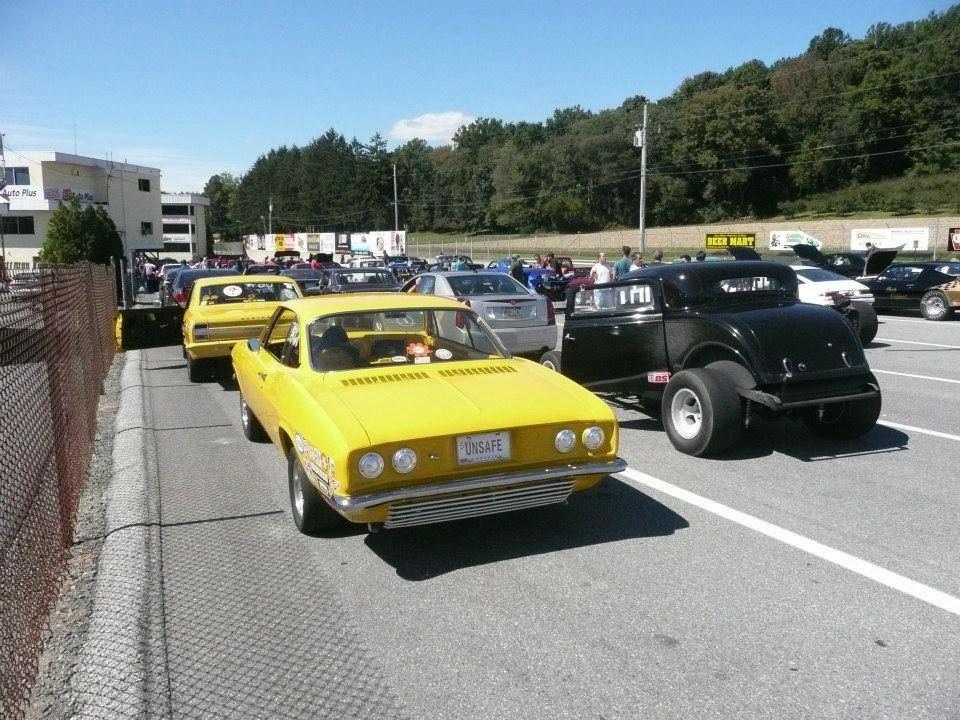 racing in this yellow Corvair coupe.