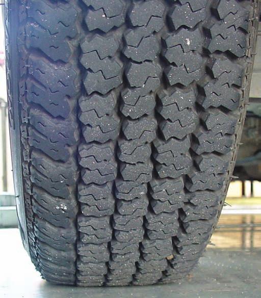Tire and Wheel Service 1147 radial tire has a bulging sidewall, and tire pressure must be dangerously low before there is a visible difference. Figure 62.