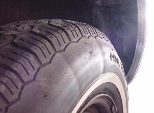 When a tire tread has scalloped or cupped wear, this is usually because the tire has been hopping up and down on the road. This movement, called wheel tramp (see Figure 62.