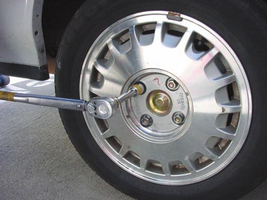 1152 CHAPTER 62 Locking lug nut Key Clearance 1 Extension 4 Torque wrench Figure 62.15 Use a socket extension to provide clearance to the tire sidewall. Tapered end faces to wheel. Figure 62.16 Lug nuts for steel wheels are tapered on the side that faces the wheel.