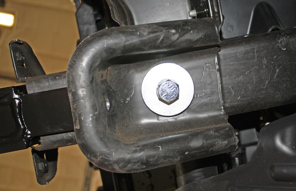 Fig.O 12. Remove one 18mm (head) bolt and nut, and one 18mm (head) bolt attaching the tow hook to the frame rail (Fig.