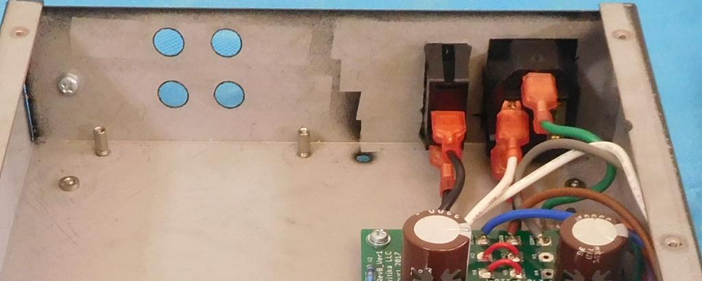 Connect the green FASTON to the top terminal on the power entry connector.