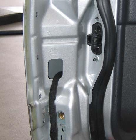 4.) Close the door extended cable harness leadthrough hole with the