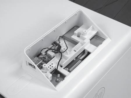 2. In the control-panel cavity, disconnect one cable connectors (1)