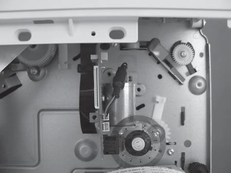 Reinstallation tip: Reinstallation tip: Fit the encoder wheel through the sensor on the back of the PCA assembly.