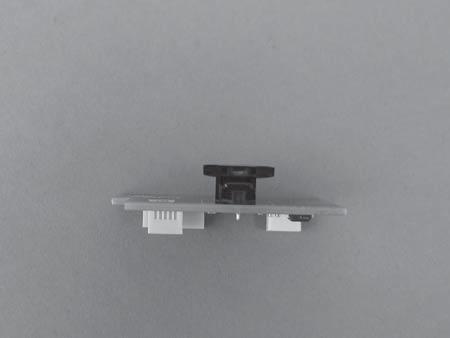 Ensure that the encoder strip threads through encoder strip sensor on the back of the sensor carriage PCA.