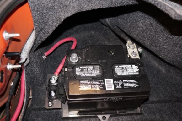 8 26. In trunk of car, secure battery to tray with provided strap and hardware. 27.