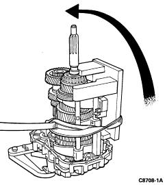 upwards. 10. If equipped, slide the output flange onto the output end of the mainshaft until it seats against its stop.