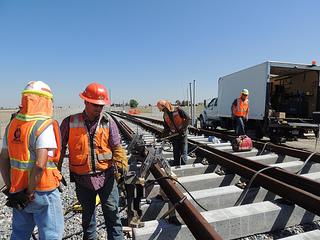 the East Rail Line. On right, Eagle P3 workers make progress on the three- pronged rail line construction project.