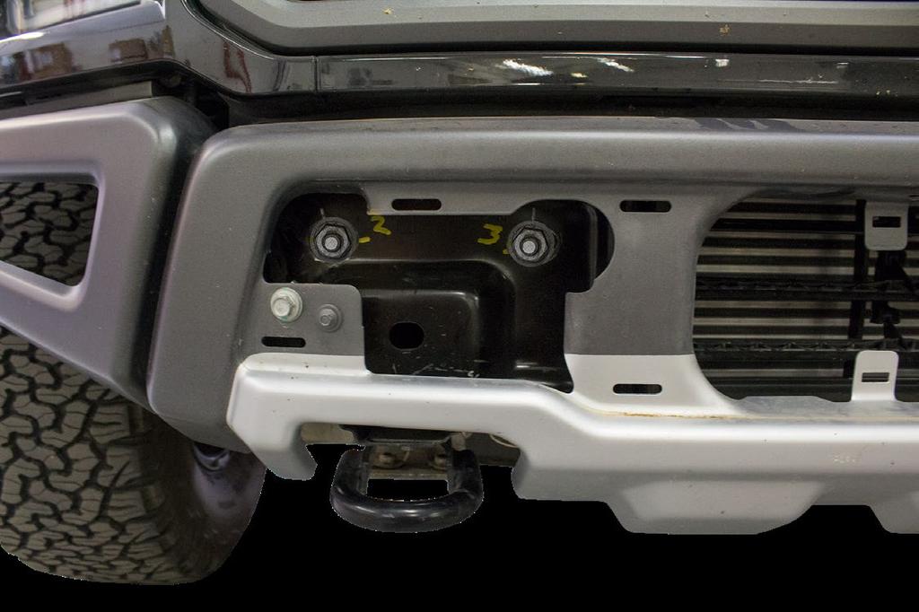 6. Use a 21mm Socket to remove the nuts that hold on the front bumper.