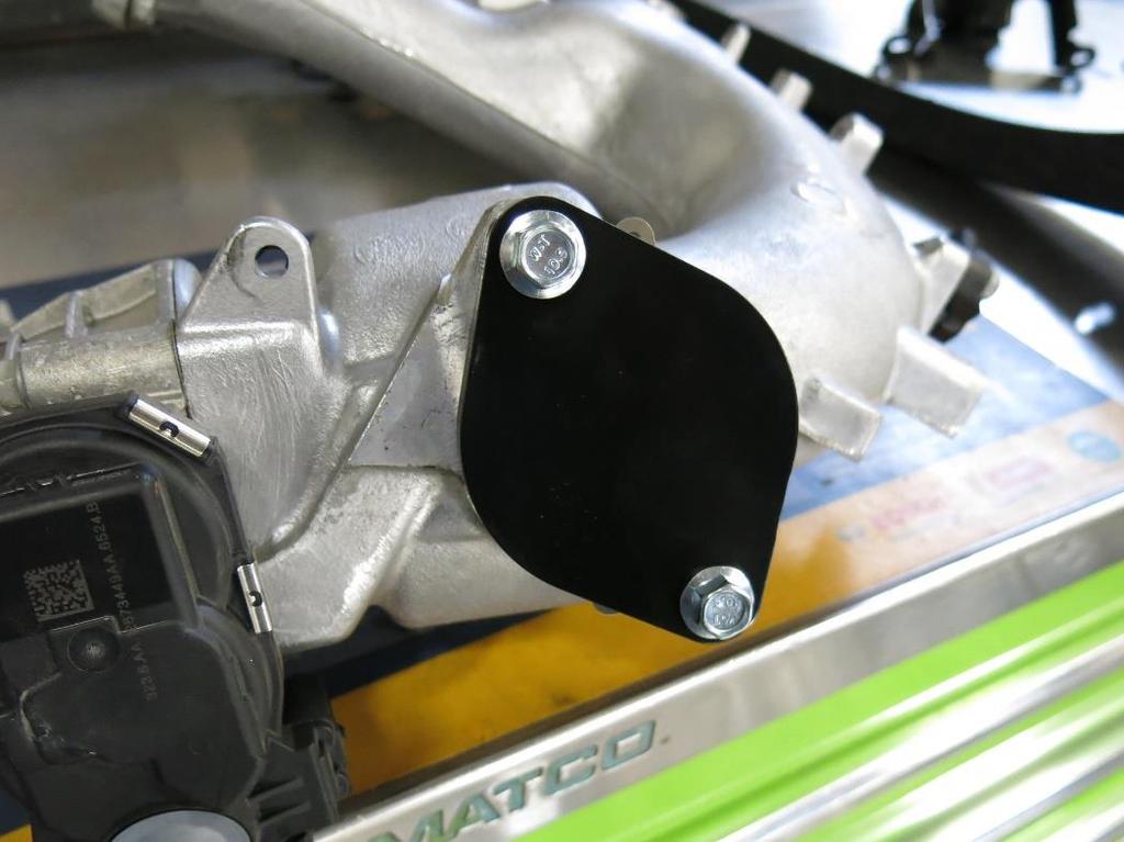 The brass barb end will connect to the OEM coolant line that tees into the coolant tank hose near the