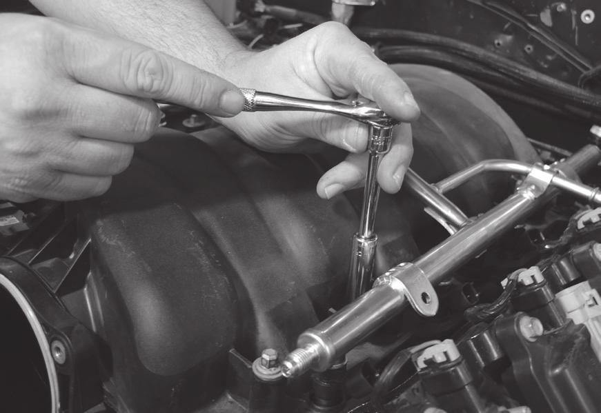 Once the fuel pressure is released, disconnect the fuel line from the fuel rail with the release tool. 2.