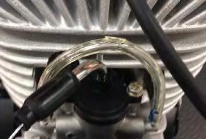 Insert the plastic tube provided on to each one of the carburetor overflow