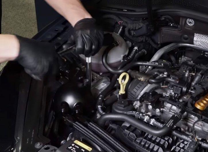 Trim the hose to have about 2-3 exposed below the car, for future convenience.