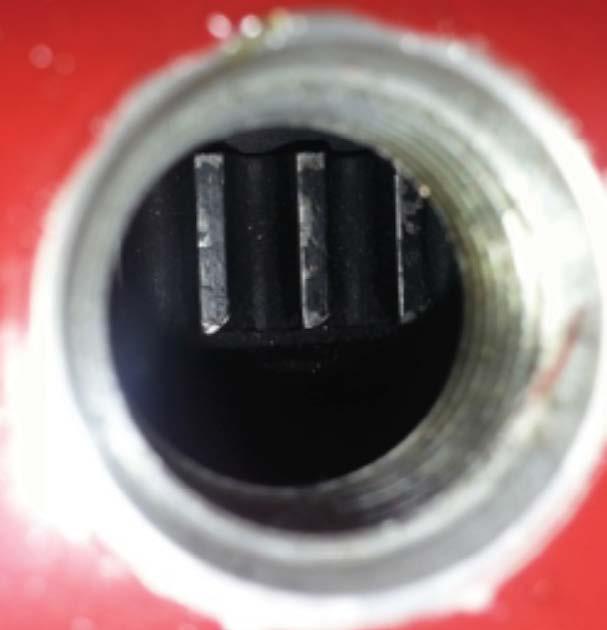 Flywheel teeth are offset from being centered in the magnetic pick-up sensor port.