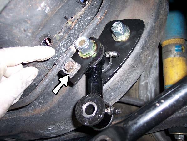 Fully tighten both short and long bolts completely.