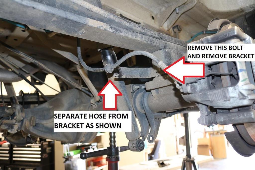 See image below. 10) Remove the brake hose from the factory lift block.