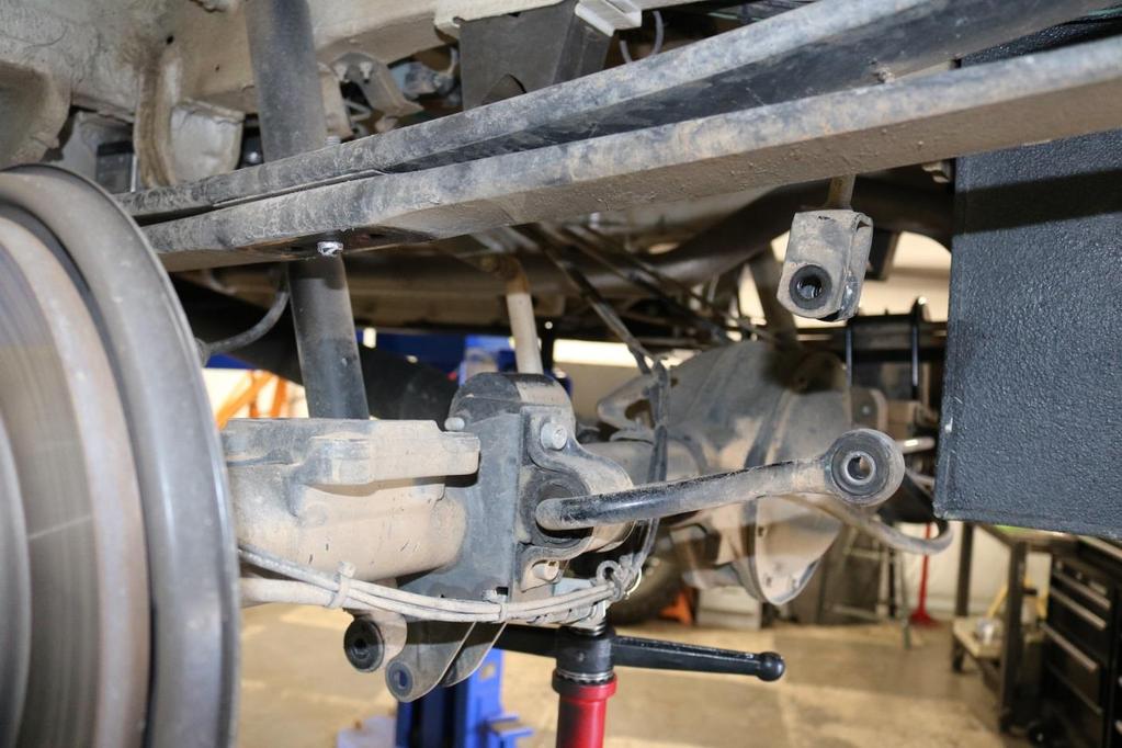11) Next, lower the axle to the point where the factory lift block can be removed.