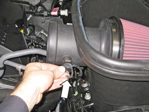 Slide the filter and tube assembly into the air box.